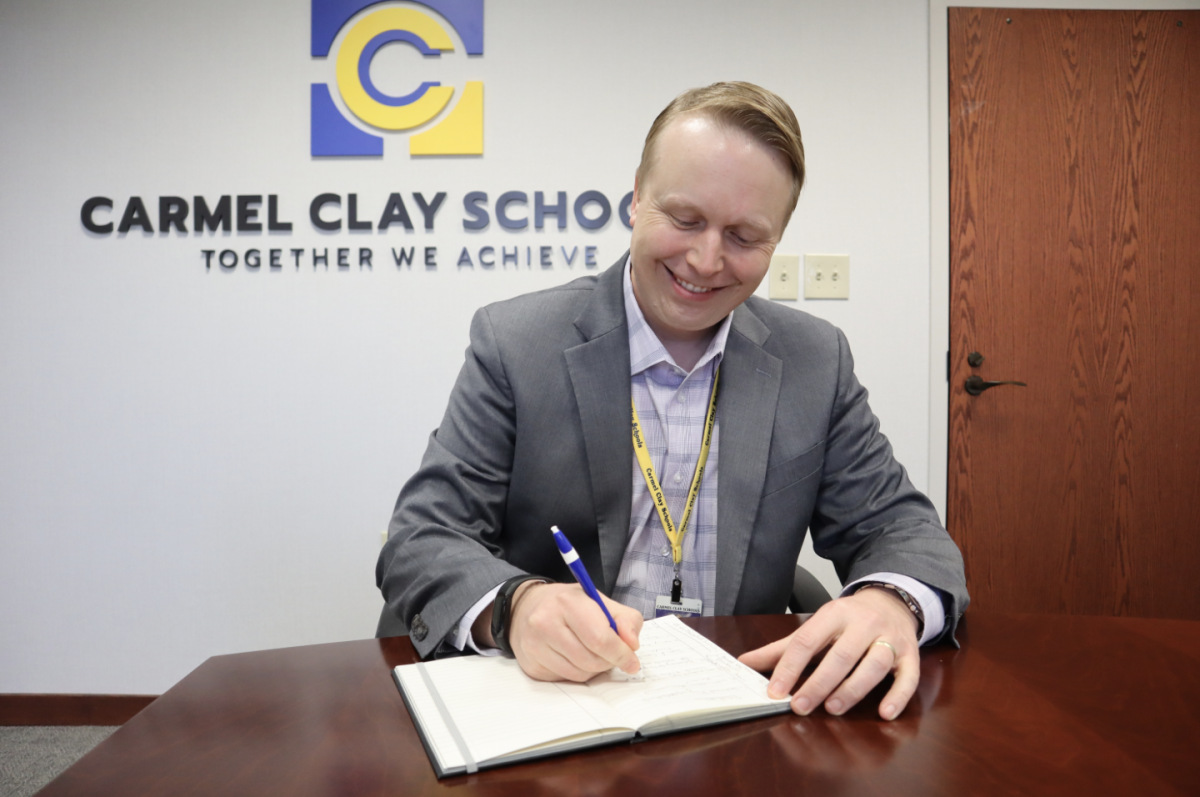 Assistant Superintendent Tom Oestreich writes down notes about upcoming job fairs on Feb. 1. Oestreich said the Northside Teacher Recruitment Fair will be held on March 13 at the Noblesville Schools Community Center.